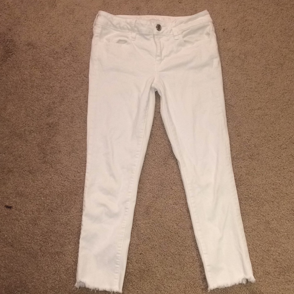 White cut bottom jeans
